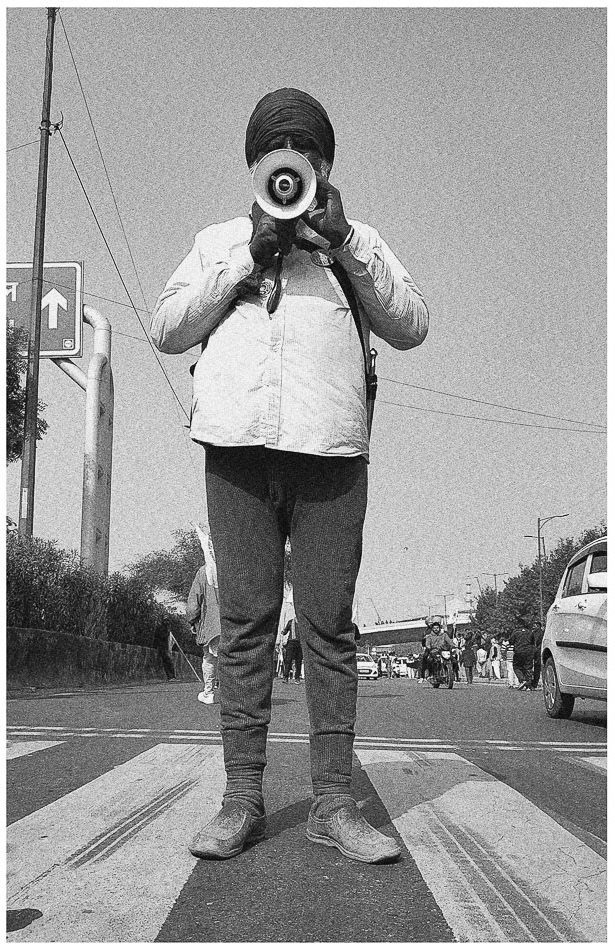 A farmer from Punjab protests during a tractor march