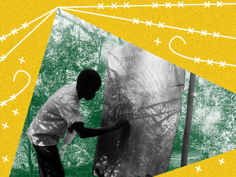 A teacher writes on the blackboard 768x576